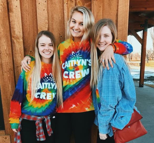 Morgan Roth, Halli Heisinger and Lauren Nustad wear Cat's Crew t-shirts to remember their friend Caitlyn Carman, who passed away in a car accident last spring. Submitted photo / The Volante