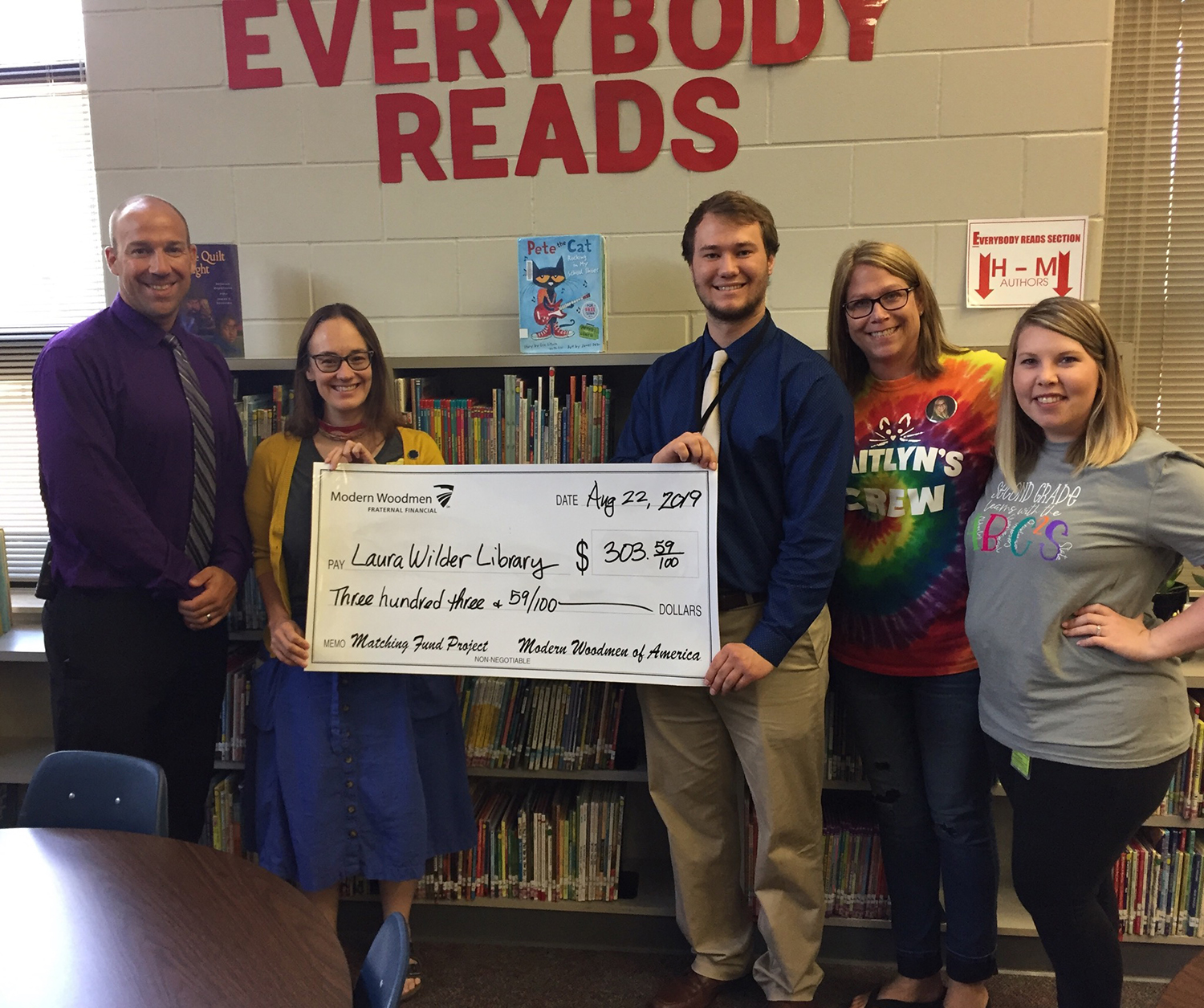 Check donation for Laura Wilder Elementary's library